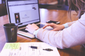 person typing on a computer