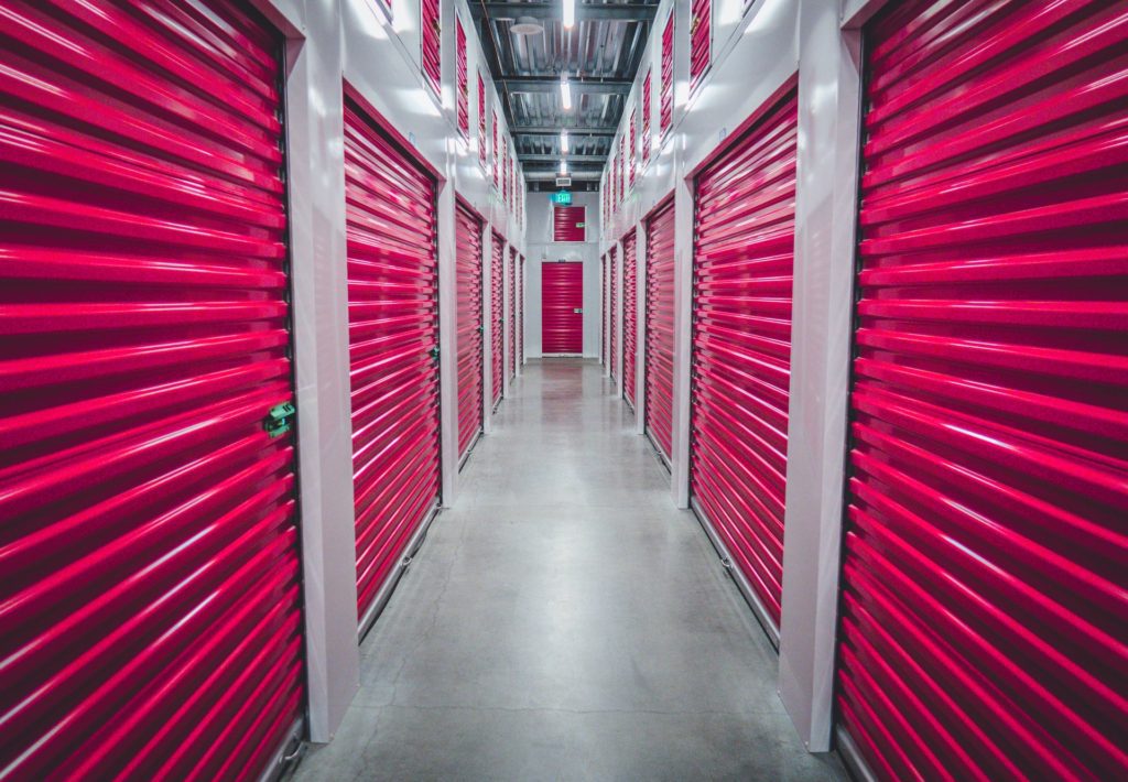The space between two rows of storage units facing one another.